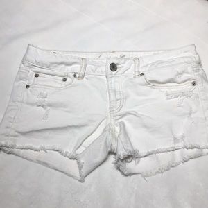 Destroyed white cut off shorts